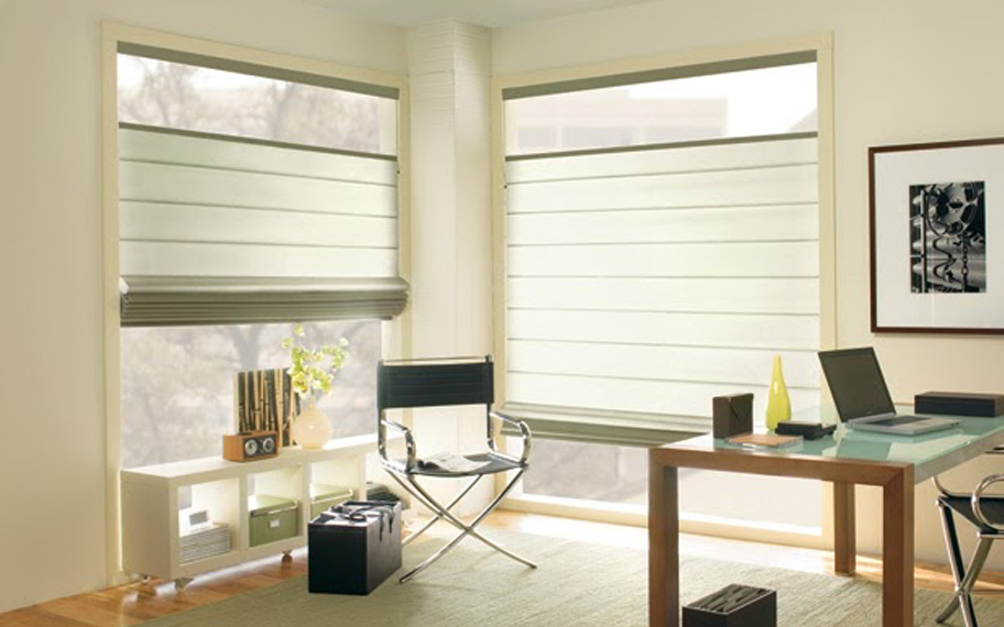 Upgrade your windows with stylish window shades or shutters in Fort Lauderdale. Stylish sheer shades in the corner of a modern office.