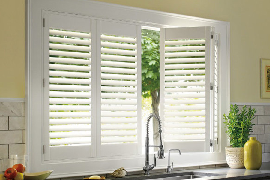 Polywood shutters are built to withstand the test of time in Fort Lauderdale. White Polywood shutters above a kitchen sink.