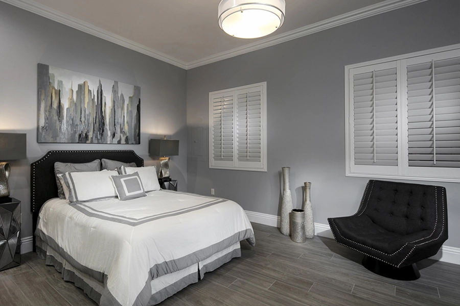 Close your custom Polywood shutters to beat the heat and keep your Fort Lauderdale bedroom cool. White Polywood shutters on bedroom windows