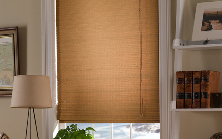 Add a touch of nature to your decor with woven fiber shades in Fort Lauderdale. Tan woven fiber shades in a living room