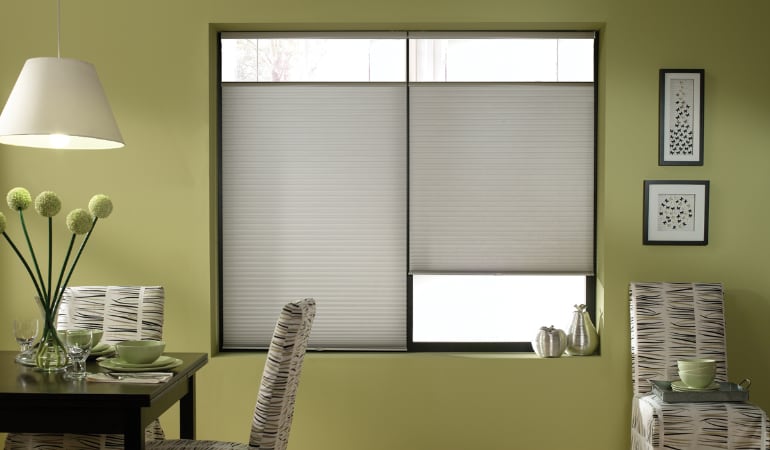 Cellular shades will keep a room's temperature consistent and reduce energy costs.  Cellular shades in a Fort Lauderdale dining room