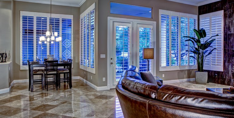 Photo Courtesy of Room Resolutions Fort Lauderdale great room with plantation shutters and modern lighting.
