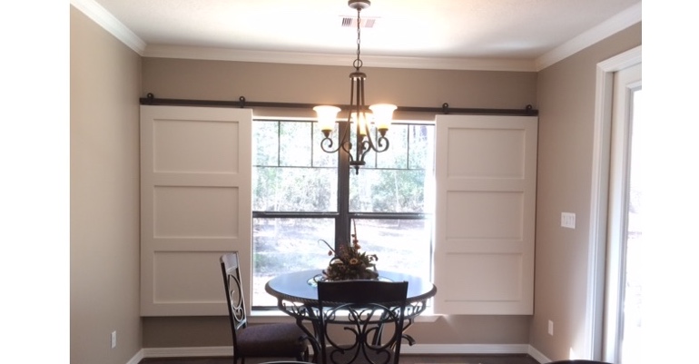 Barn doors open horizontally with slides instead of cords. Fort Lauderdale barn door shutters