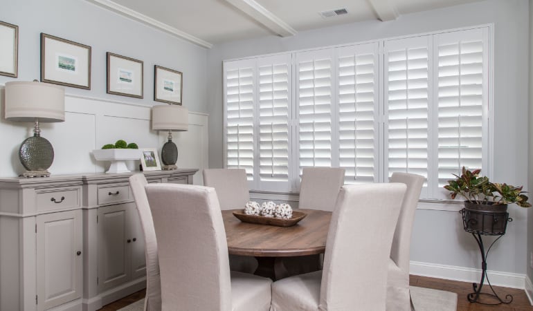 Plantation shutters are a perfect choice for homeowners looking for privacy or natural light. Plantation shutters in a Fort Lauderdale dining room.