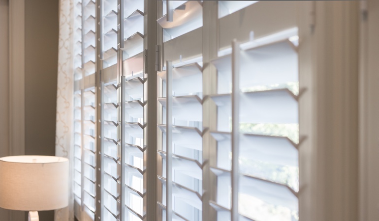 East-West windows often have problems with glare from sunrises and sunsets. Plantation shutters close up