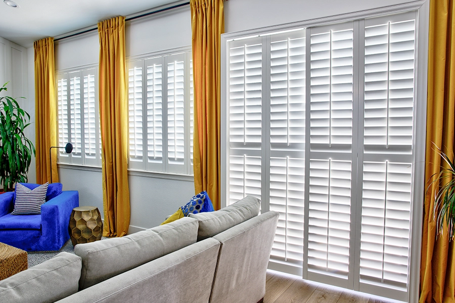 All you need is a duster and damp cloth to get your beautiful Polywood shutters shining again.  White Polywood shutters on living room windows